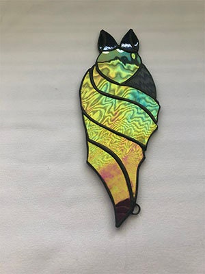Hanging mirrored vampire bat. Nine inches long, three inches wide. Great Halloween sun catcher for your window.